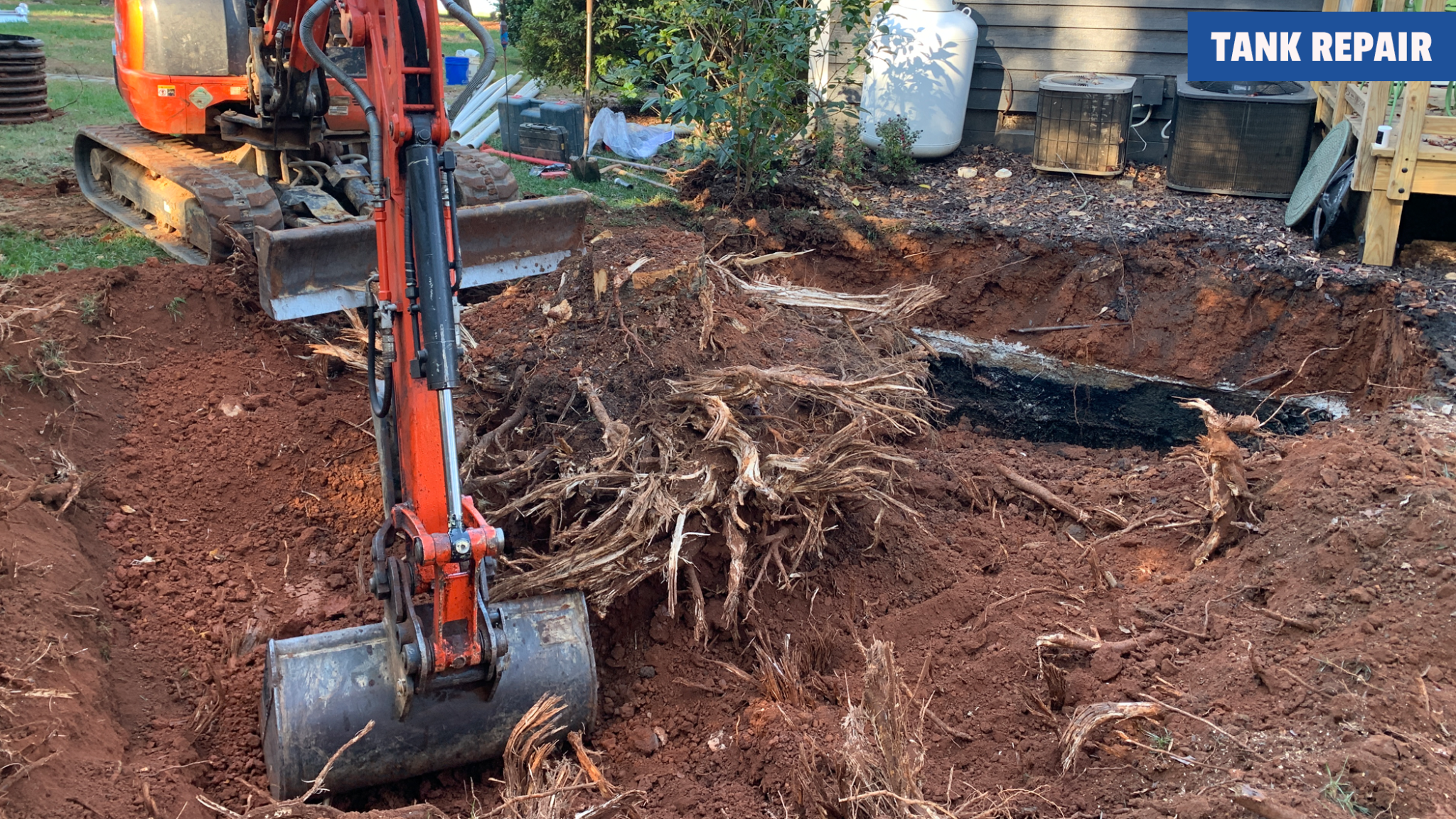 TW Ammons Septic - Removing a large tree stump during the crush and fill of an old septic tank.