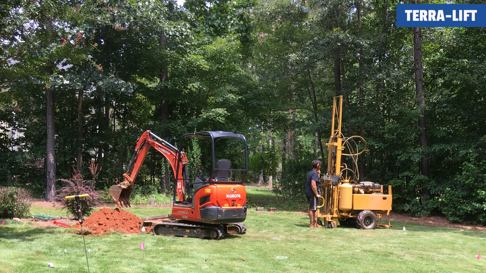 TW Ammons Septic - Watching the Terra-lift fracking the drain field next to our excavator.